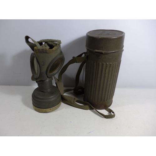 322 - A MID 20TH CENTURY GERMAN GAS MASK AND METAL CONTAINER