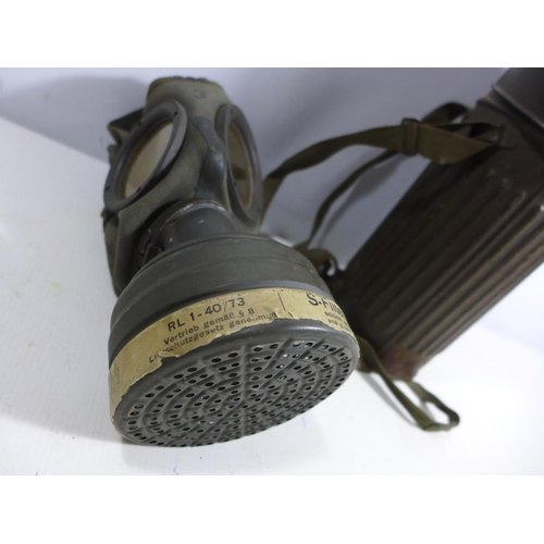 322 - A MID 20TH CENTURY GERMAN GAS MASK AND METAL CONTAINER