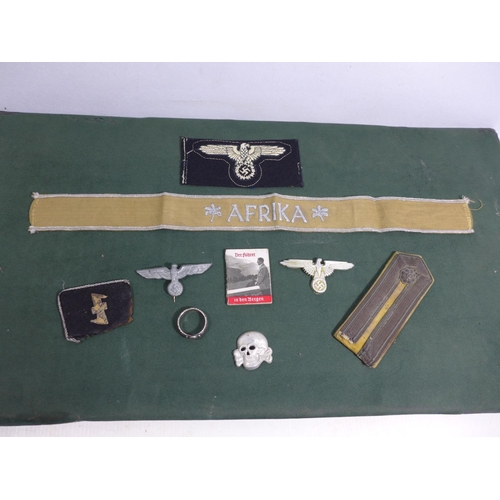 327 - A COLLECTION OF NAZI GERMANY WORLD WAR II BADGES TO INCLUDE AN AFRIKA CORPS TALLY, MINIATURE ADOLF H... 