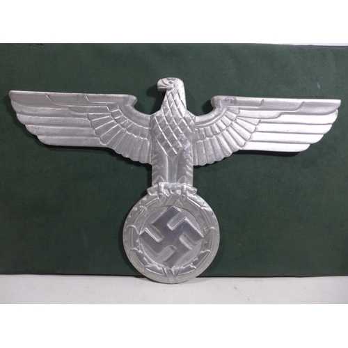 328 - A LARGE ALUMINIUM EAGLE AND SWASTIKA PLAQUE, WIDTH 38CM, HEIGHT 24.5CM