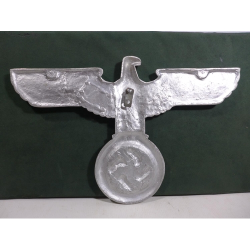 328 - A LARGE ALUMINIUM EAGLE AND SWASTIKA PLAQUE, WIDTH 38CM, HEIGHT 24.5CM