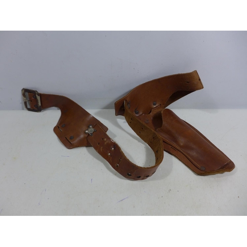 340 - A LEATHER GUN HOLSTER AND BELT