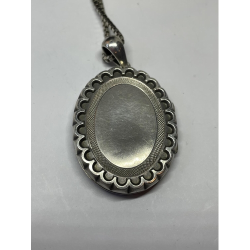 539 - A WWI SILVER LOCKET AND CHAIN