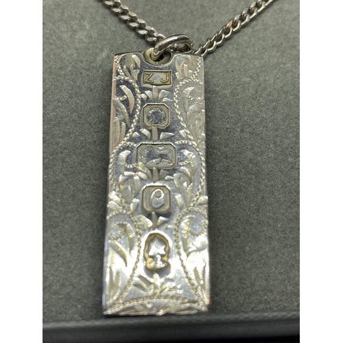 548 - AN ORNATE SILVER INGOT AND CHAIN IN  A PRESENTATION BOX