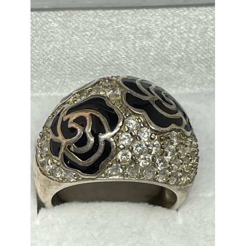 549 - A SILVER RING WITH CUBIC ZIRCONIAS IN A PRESENTATION BOX