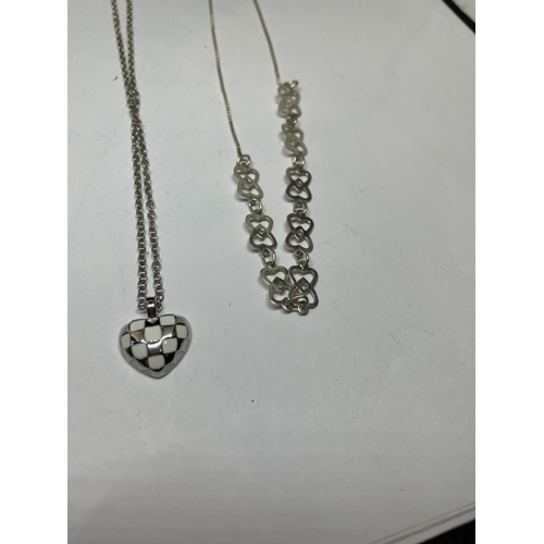 551 - FOUR SILVER NECKLACES WITH PENDANTS