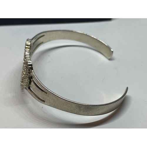 577 - A SILVER BANGLE IN A PRESENTATION BOX