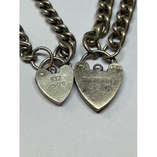 597 - TWO SILVER PADLOCK BRACELETS