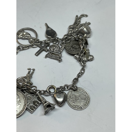 609 - A SILVER CHARM BRACELET