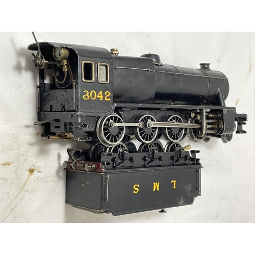 311 - A SCRATCH BUILT LIVE STEAM 30 MM GAUGE 2-8-0 MODEL RAILWAY LOCOMOTIVE AND TENDER NUMBER 8042 IN BLAC... 