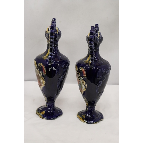 114 - A PAIR OF VICTORIAN VASES IN COBALT BLUE WITH PICTORIAL DECORATION, HEIGHT 41 CM