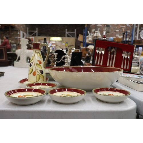 141 - A QUANTITY OF 'MAXWELL WILLIAMS' TABLEWARE TO INCLUDE LARGE SERVING PLATES AND BOWLS, AN OIL BOTTLE,... 