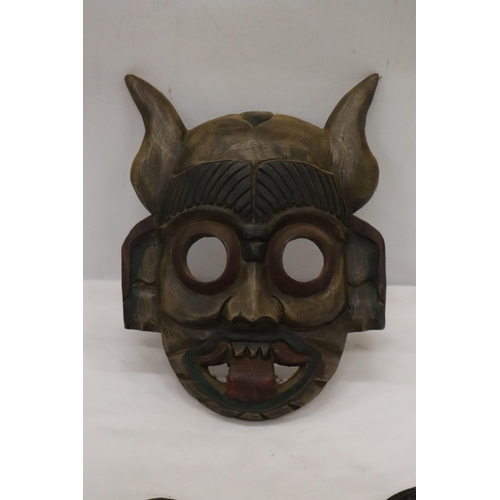 153 - THREE WOODEN CARVED 'TRIBAL STYLE' MASKS