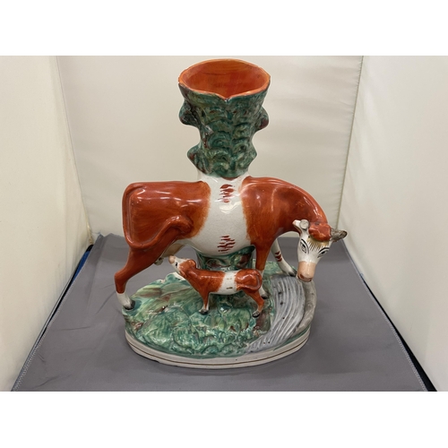 167 - A VINTAGE STAFFORDSHIRE FLATBACK COW AND CALF SPILL HOLDER, HEIGHT 30CM