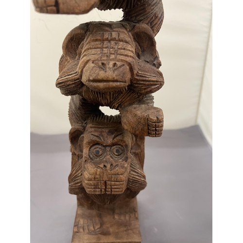 169 - A CARVED WOODEN SCULPTURE OF SEE NO EVIL, SPEAK NO EVIL, HEAR NO EVIL, MONKEYS