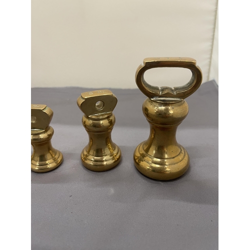 174 - A COLLECTION OF VINTAGE BRASS BELL WEIGHTS