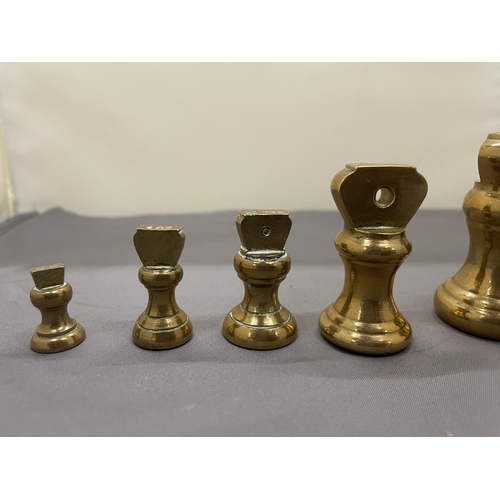 174 - A COLLECTION OF VINTAGE BRASS BELL WEIGHTS