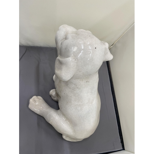 185 - A LARGE CERAMIMC MODEL OF A PUPPY DOG, HEIGHT 26CM, WIDTH 25CM