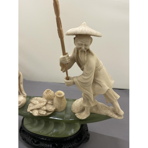 190 - AN ORIENTAL CARVING OF FISHERMEN ON A POSSIBLY JADE BOAT, HEIGHT 20CM, WIDTH 27CM