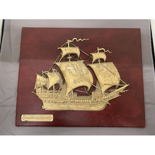 210 - A VINTAGE EMBOSSED SPANISH GALLEON ON RED MOROCCO LEATHER, 30CM X 24CM