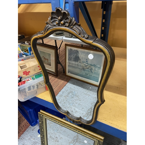 219A - A GILT FRAMED MIRROR AND A SCALLOPED SHAPED MIRROR