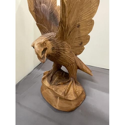 243 - A HAND CARVED WOODEN EAGLE, HEIGHT 37CM