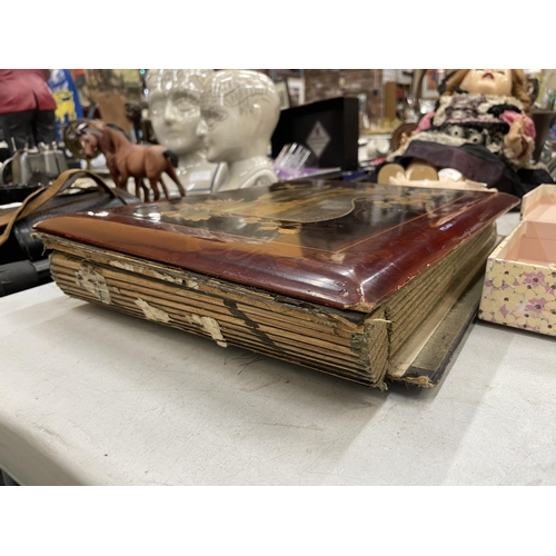 271 - A VICTORIAN ORNATE POSTCARD ALBUM WITH POSTCARDS