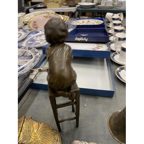 279 - A SIGNED BRONZE CHILD ON A CHILD, HEIGHT 24CM