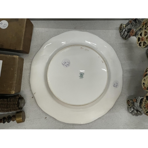 297 - A COALPORT GILT AND BLUE CABINET PLATE WITH CENTRE PAINTING OF A CASTLE