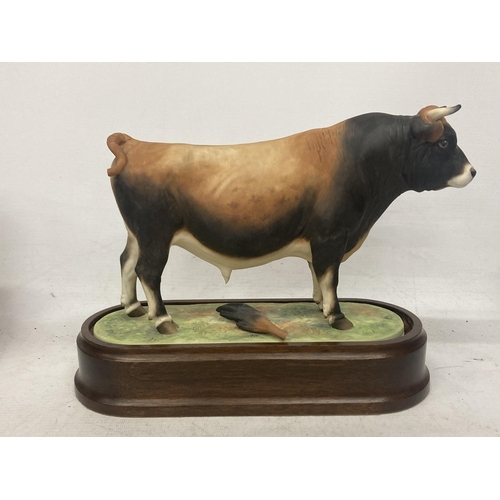 702 - A ROYAL WORCESTER MODEL OF A JERSEY BULL MODELLED BY DORIS LINDNER PRODUCED IN A LIMITED EDITION OF ... 