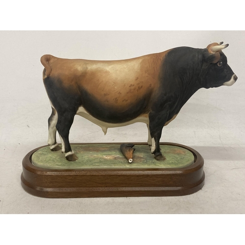 704 - A ROYAL WORCESTER MODEL OF A JERSEY BULL MODELLED BY DORIS LINDNER PRODUCED IN A LIMITED EDITION OF ... 