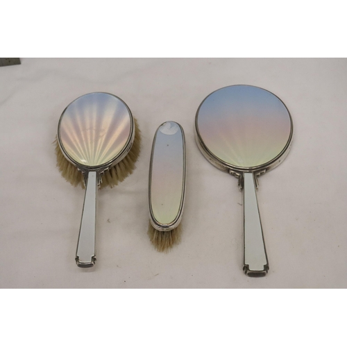 26 - AN ENAMEL AND HALLMARKED LONDON SILVER TWO BRUSH AND MIRROR SET