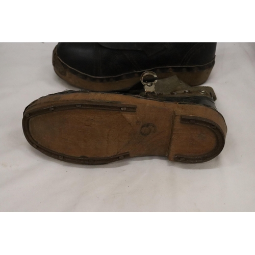 34 - A PAIR OF VINTAGE LEATHER AND WOODEN CLOGS