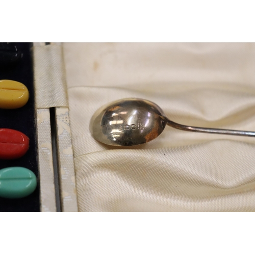 5 - A SET OF SIX HALLMARKED SHEFFIELD SILVER COFFEE BEAN SPOONS WITH VARIOUS COLOURED TOPS IN A PRESENTA... 