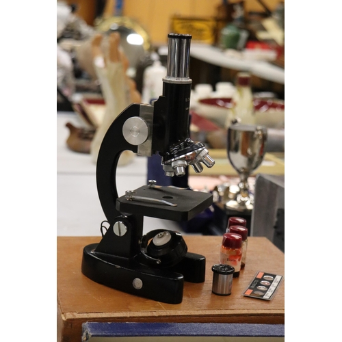159 - A VINTAGE LUNAX MICROSCOPE WITH A LARGE QUANTITY OF SLIDES IN A WOODEN BOX