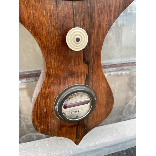 1514 - AN OAK CASED WALL HANGING BAROMETER