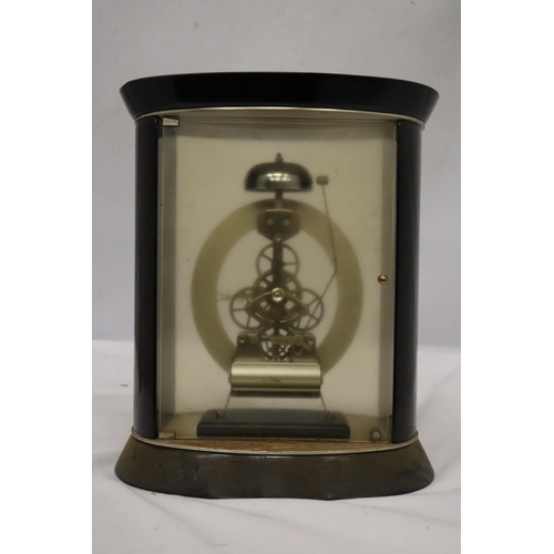 29 - A DAVID PETERSON STYLE OVAL GLASS AND MAHOGANY SKELETON CLOCK WITH PASSING STRIKE MOVEMENT HEIGHT 25... 