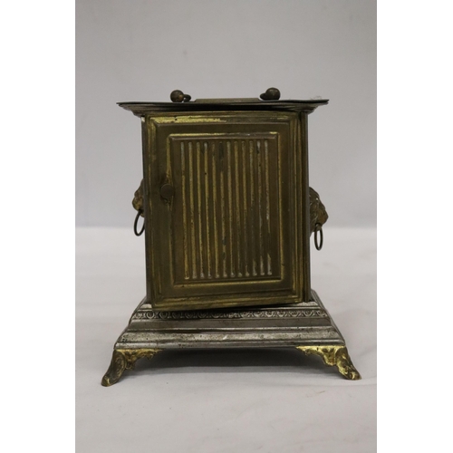 18 - AN ORNATE VINTAGE ALARM CARRIAGE CLOCK WITH LION HANDLE DECORATION TO THE SIDES - POSSIBLY AN OFFICE... 