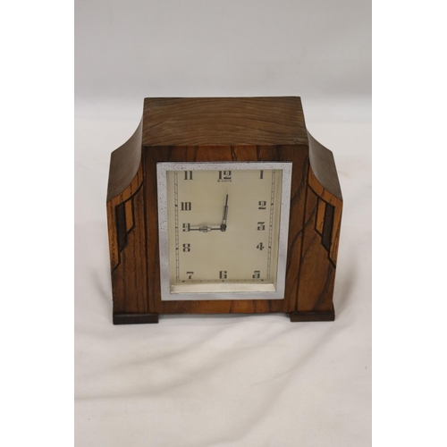 43 - A DECO STYLE OAK  8 DAY MANTLE CLOCK WITH WIND UP MECHANISM SEEN WORKING BUT NO WARRANTY