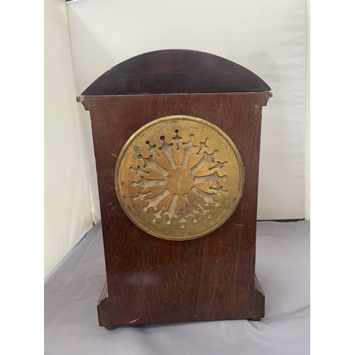 63 - A MAHOGANY INLAID MANTLE CLOCK WITH INSCRIPTION PLATE (A/F LEG MISSING)