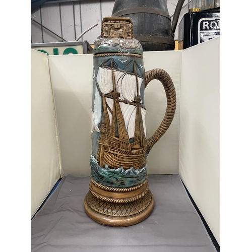 74 - A LARGE ART AND CRAFTS GALLEON LIDDED JUG