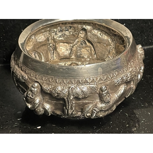91 - AN INDIAN SILVER DISH DECORATED WITH CHERUBS GROSS WEIGHT 230 GRAMS