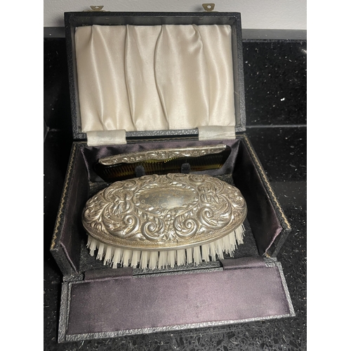 92 - A HALLMARKED BIRMINGHAM SILVER BRUSH AND COMB SET IN A PRESENTATION BOX