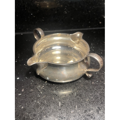 94 - A HALLMARKED LONDON SILVER DOUBLE SPOUTED JUG WITH TWIN HANDLES GROSS WEIGHT 106 GRAMS