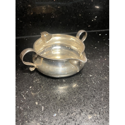 94 - A HALLMARKED LONDON SILVER DOUBLE SPOUTED JUG WITH TWIN HANDLES GROSS WEIGHT 106 GRAMS
