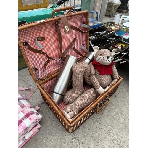 1858 - AN ASSORTMENT OF PICNIC ITEMS TO INCLUDE A WICKER HAMPER, A PICNIC BLANKET AND A FOLDING TABLE ETC