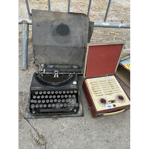 1864 - A VINTAGE REMINGTON TYPEWRITER WITH CARRY CASE AND A RETRO RADIO