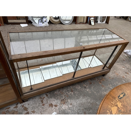 2969 - AN EARLY 20TH CENTURY FRAMED GLASS SHOP DISPLAY COUNTER 71