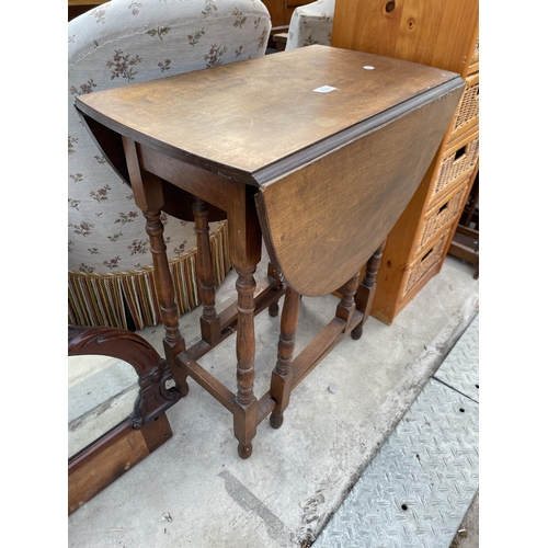 2589 - A SMALL OVAL GATE LEG TABLE, 37