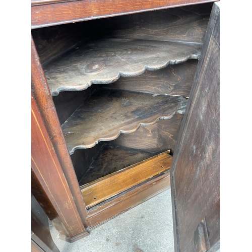 2650 - A GEORGE III OAK AND MAHOGANY INLAID CORNER CUPBOARD WITH SHAPED INTERIOR SHELVES